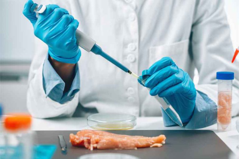 lab worker using a syringe