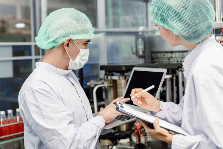 lab workers with clipboard