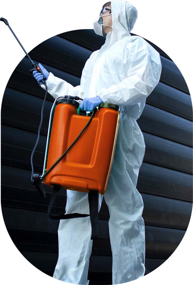 worker spraying with orange jug