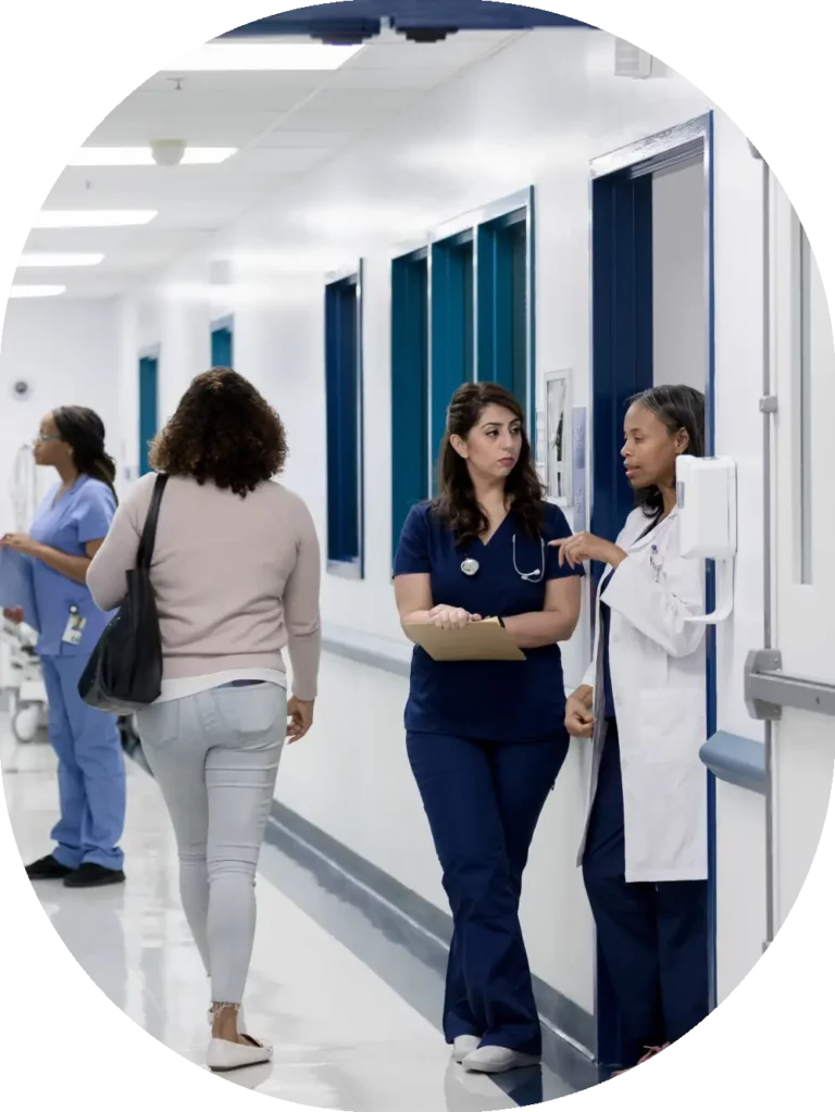 medical staff speaking in a hallway