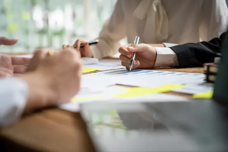 teamwork with business people analysis cost graphs